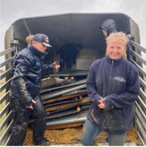 Jimmy's Farm team working in the rain to clear debris